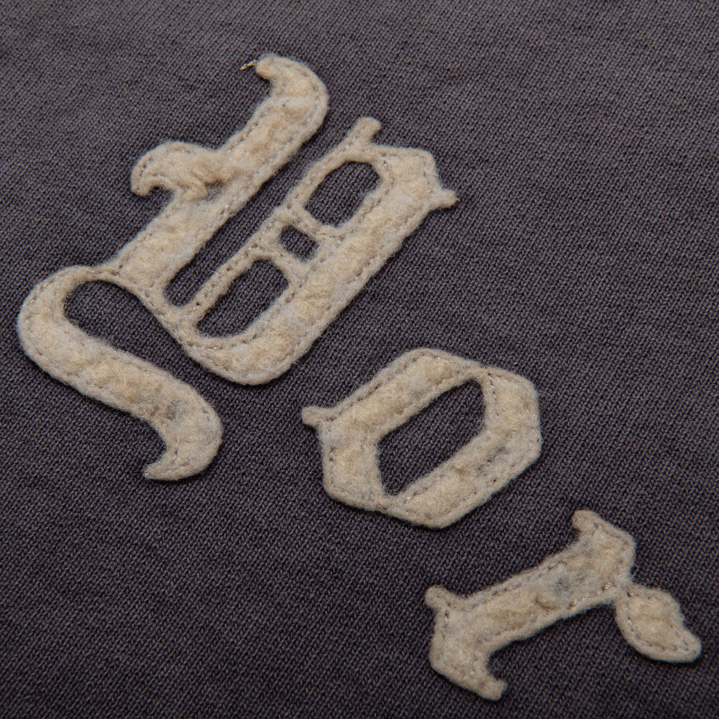 DAMAGED LETTERED CREW VEST